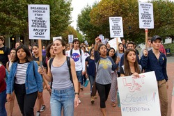 Berkeley, CA - September 05, 2017: Unidentified participants protesting Trump rescinding DACA,. Approximately 200 demonstrators gathered in UC Berkeley’s Sproul Plaza and marched down Telegraph Avenue