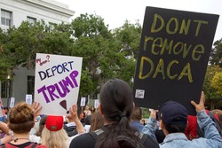 Berkeley, CA - September 05, 2017: Unidentified participants protesting Trump rescinding DACA,. Approximately 200 demonstrators gathered in UC Berkeley’s Sproul Plaza and marched down Telegraph Avenue