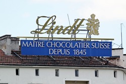 Sofia, Bulgaria - July 04, 2017: Advertisement of Chocolats Lindt on a building rooftop. Lindt is a brand of the Lindt & Sprungli AG - a Swiss company, founded in 1845.