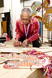 KUALA LUMPUR, MALAYSIA - MARCH 4: Naim Marjani, a traditional kuda kepang (a horse dance) maker does a demonstration at the Malaysia National Craft Day 2011 on March 4, 2011 in Kuala Lumpur, Malaysia