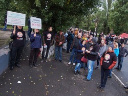 Kryvyi Rih, Ukraine - October 9, 2017: Kryvyi Rig citizens at protest meeting near the ArcelorMittal Kryvyi Rih claim to reduce air pollution and conduct an independent audit of cleaning equipment