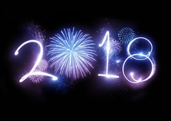 The year 2018 displayed with fireworks and strobes. New year and holidays concept.