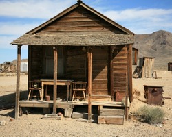 an old gold miners shack in a real ghost town from the 1800's in the wild west of california or nevada