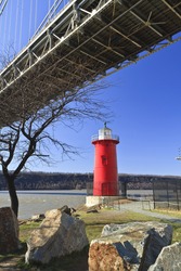 The 'Little Red Lighthouse' underneath the George Washington Bridge on the Hudson River in upper Manhattan in New York, NY