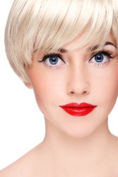 Close-up portrait of young beautiful blond girl with stylish make-up, on white background