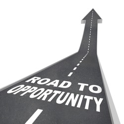 The words Road to Opportunity in white letters on a street leading to an arrow symbolizing change, success and a chance at greatness