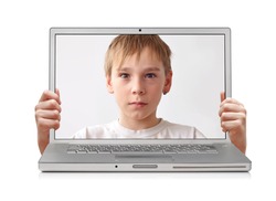 Young boy inside laptop, hands holding screen, clipping path