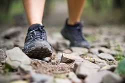 Sport shoes and exercise walking in summer, fitness concept. Jogging or training outside in summer nature, motivational health and inspirational idea.