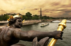 View on Seine River and Eiffel Tower from Alexander III bridge (pont Alexandre III) in Paris, France.