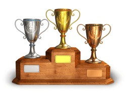 Gold, silver and bronze trophy cups on wooden pedestal isolated on white background