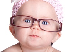 A very cute image of an adorable baby wearing glasses. This baby is already saving for her college fund!