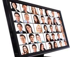 Portraits of smiling people on a computer monitor