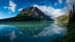 In Banff National Park, Alberta, Canada, a beautiful reflection of the mountain peaks around Lake Louise.