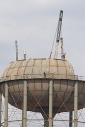 City water supply tank under construction, deep wells have to be dug to have enough water to keep the tank full