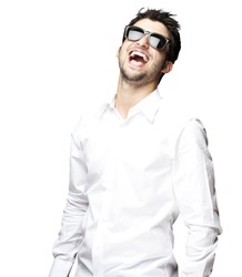 portrait of a handsome young man with sunglasses enjoying over white background