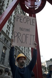 NEW YORK - OCTOBER 05: Kevin Gunderson of New York holds sign at the rally with 'Occupy Wall Street' in Downtown Manhattan on October 05, 2011 in New York.
