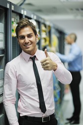group of young business people it engineer in network server room solving problems and give help and support