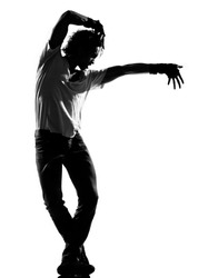 full length silhouette of a young man dancer dancing funky hip hop r&b on isolated studio white background