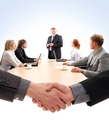 Business group of two young ladies, two young men and a mature boss at work isolated on white