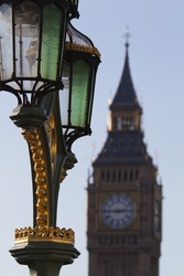 an antique street lamp on the Westminster bridge with the Big Ben in the background