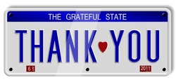 White car number plates spelling thank you on the white background / Thank you number plates