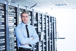 young handsome business man engeneer in datacenter server room