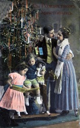 RUSSIA - CIRCA 1913: Postcard printed in Russia shows family near Christmas tree, circa 1913