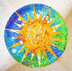 Ceiling with a sun mosaic at the Parc Guell designed by Antoni Gaudi, Barcelona, Spain.