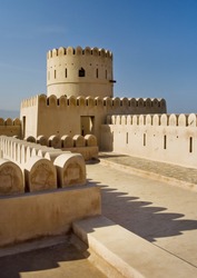 Historic adobe fortification, watchtower of Sunaysilah Castle or Fort in Sur, Al Sharqiya Region. Sultanate of Oman, Middle East