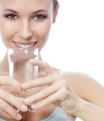portrait of attractive caucasian smiling woman isolated on white studio shot drinking water
