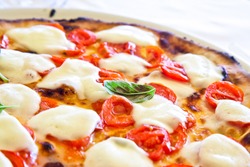 This is a true Italian Pizza. Traditional Pizza Margherita served in a Capri's restaurant, Naples Gulf, Italy.