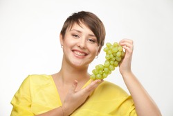 portrait of attractive caucasian smiling woman isolated on white studio shot with grapes