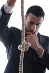 Business man pulling and bond tied with rope concept isolated on white background in studio