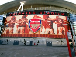 LONDON - JULY 24. One of the 8 murals installed on the exterior of Arsenal FC Emirates Stadium, the Arsenalisation project depicting four Arsenal legends linking arms on Jul 24, 2011, London, England.
