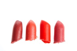 Multicoloured scraps of lipstick isolated on white background