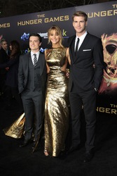 LOS ANGELES, CA - MARCH 12: Josh Hutcherson, Jennifer Lawrence, Liam Hemsworth at the premiere of Lionsgate's 'The Hunger Games' at Nokia Theater L.A. Live on March 12, 2012 in Los Angeles, California