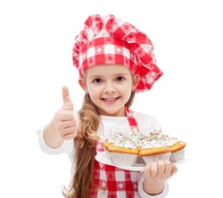 My first muffins are ready - little girl with chef hat and cookies, isolated