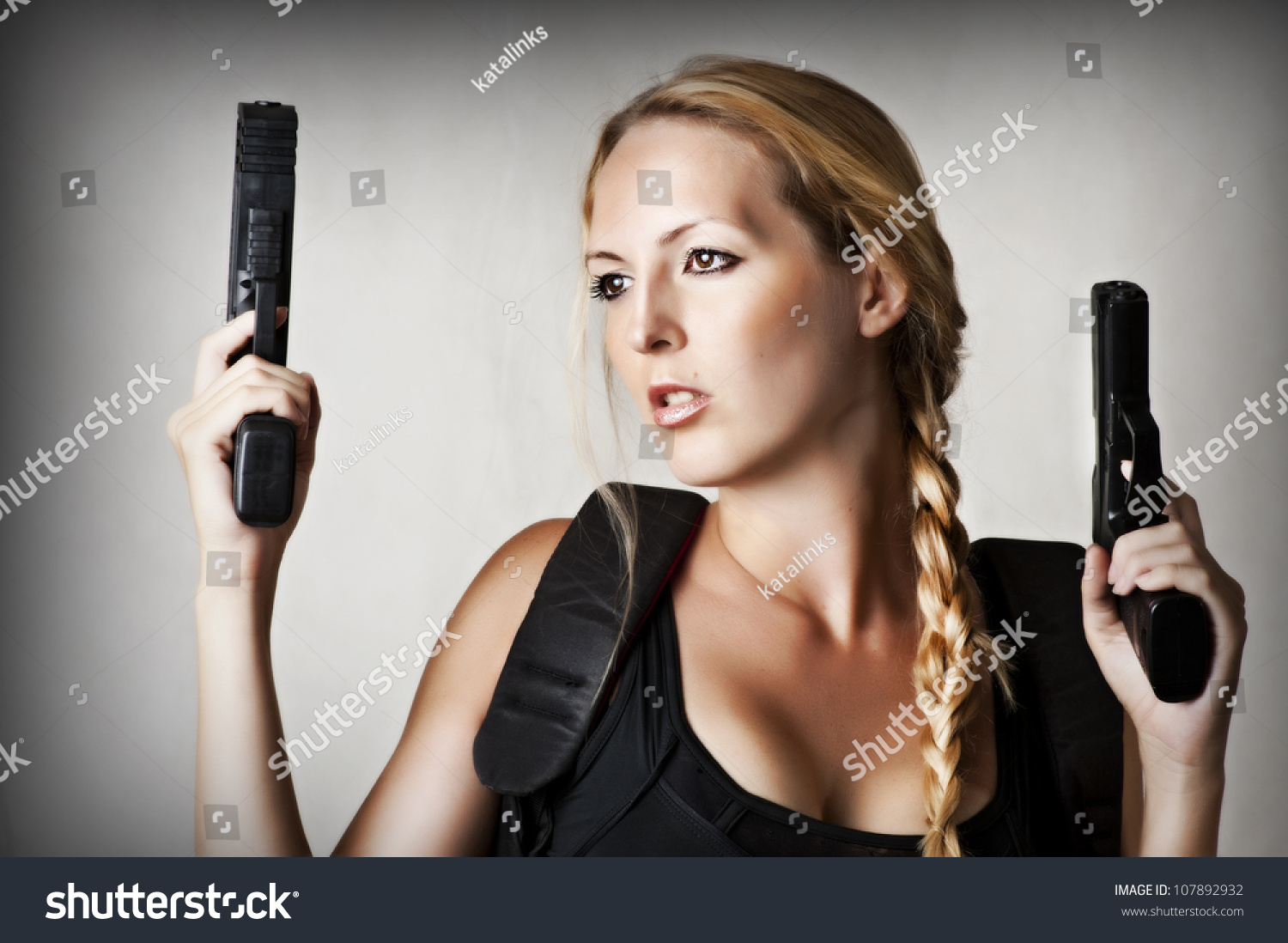 Sexy Beautiful Dangerous Woman Shooting Two Stock Photo