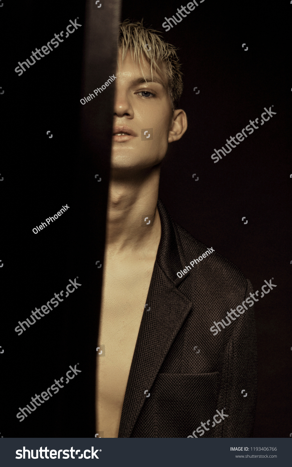 Handsome Stripped Blonde Male Model Wearing Stock Photo