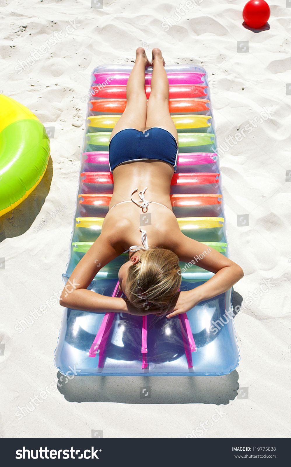 Woman Sunbathing On Her Stomach Wearing Shutterstock