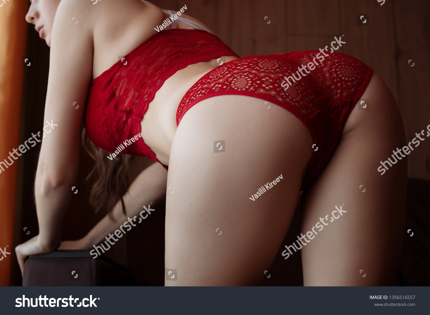 Стоковая фотография 1356516557 Sensual Nude Woman Lingerie Stockings