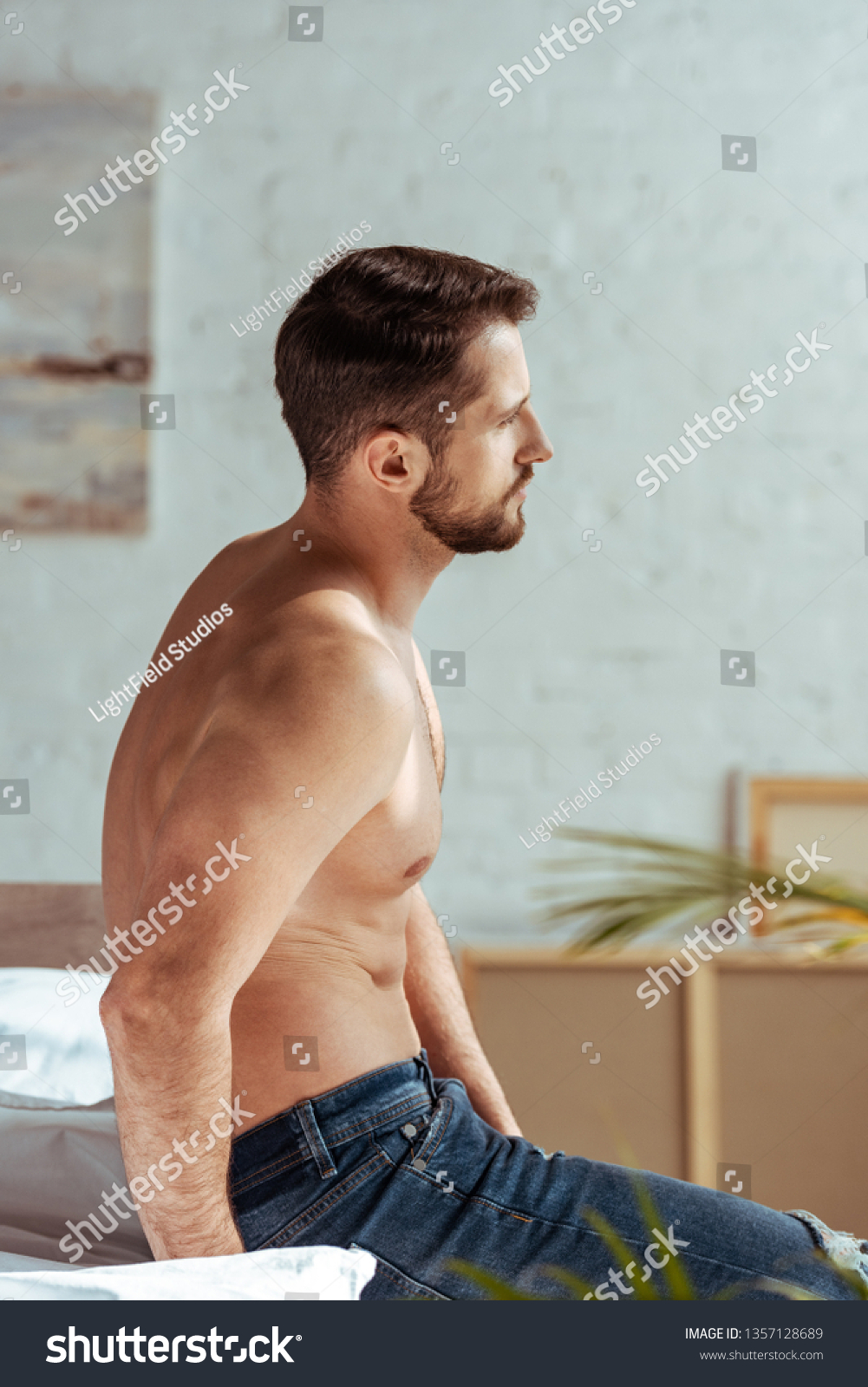 Side View Goodlooking Muscular Man Sitting Stock Photo 1357128689