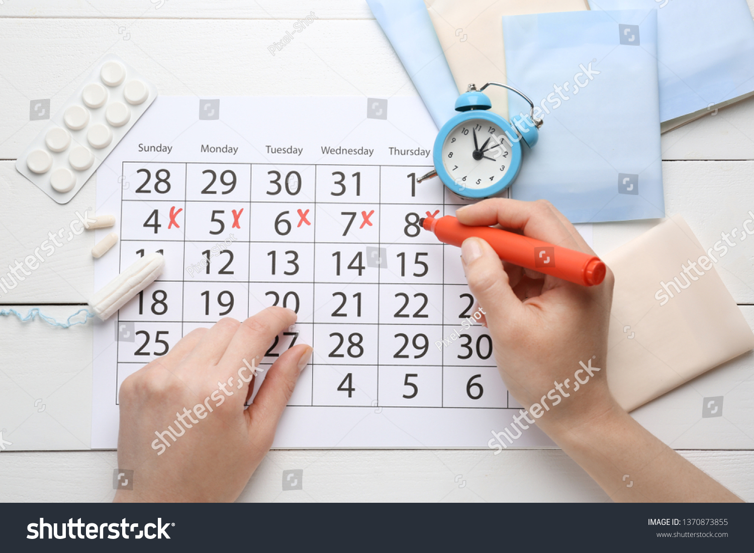 Woman Marking Her Period Menstrual Calendar Stock Photo