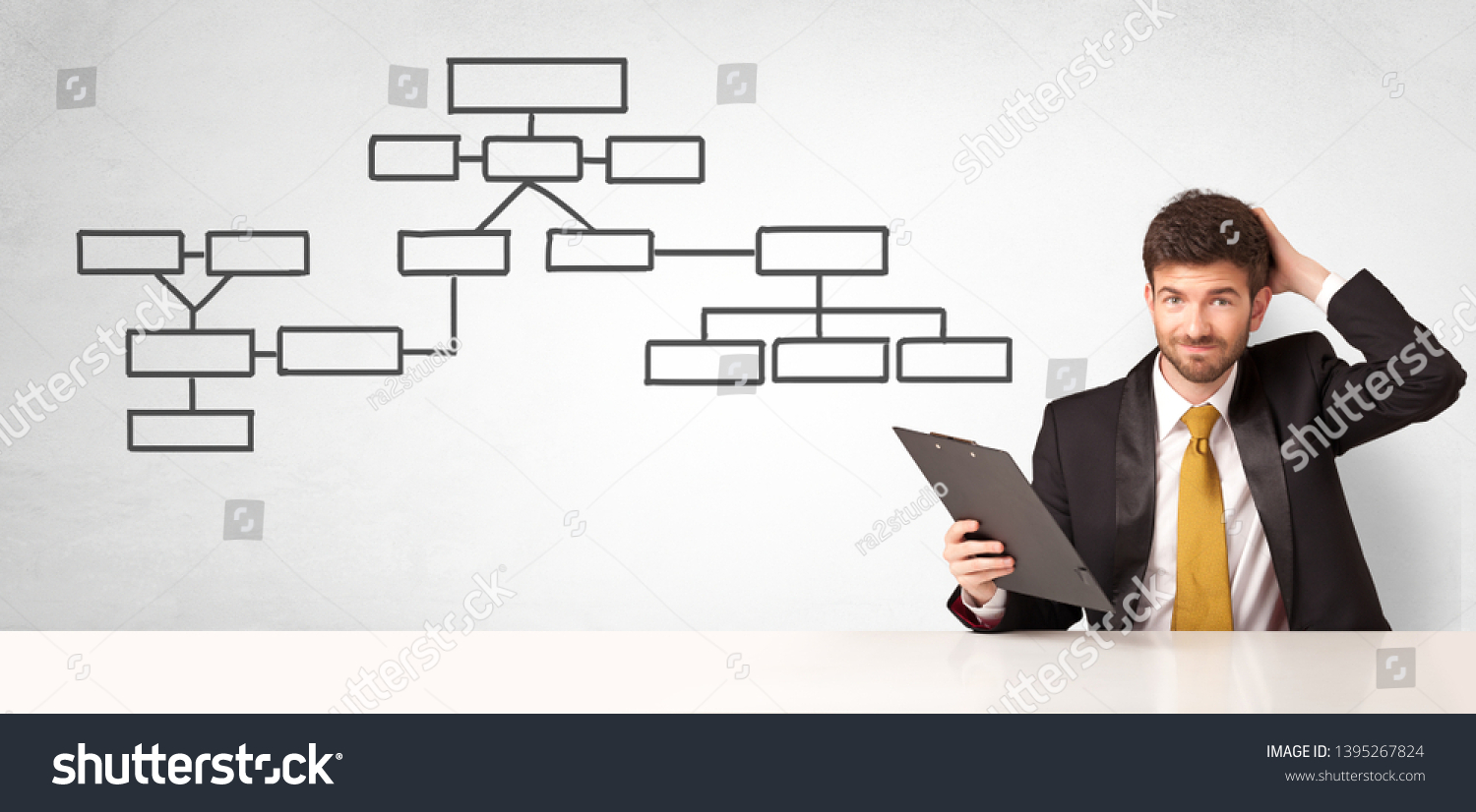 Businessman Sitting Desk Presenting Organizational Chart Stock Photo