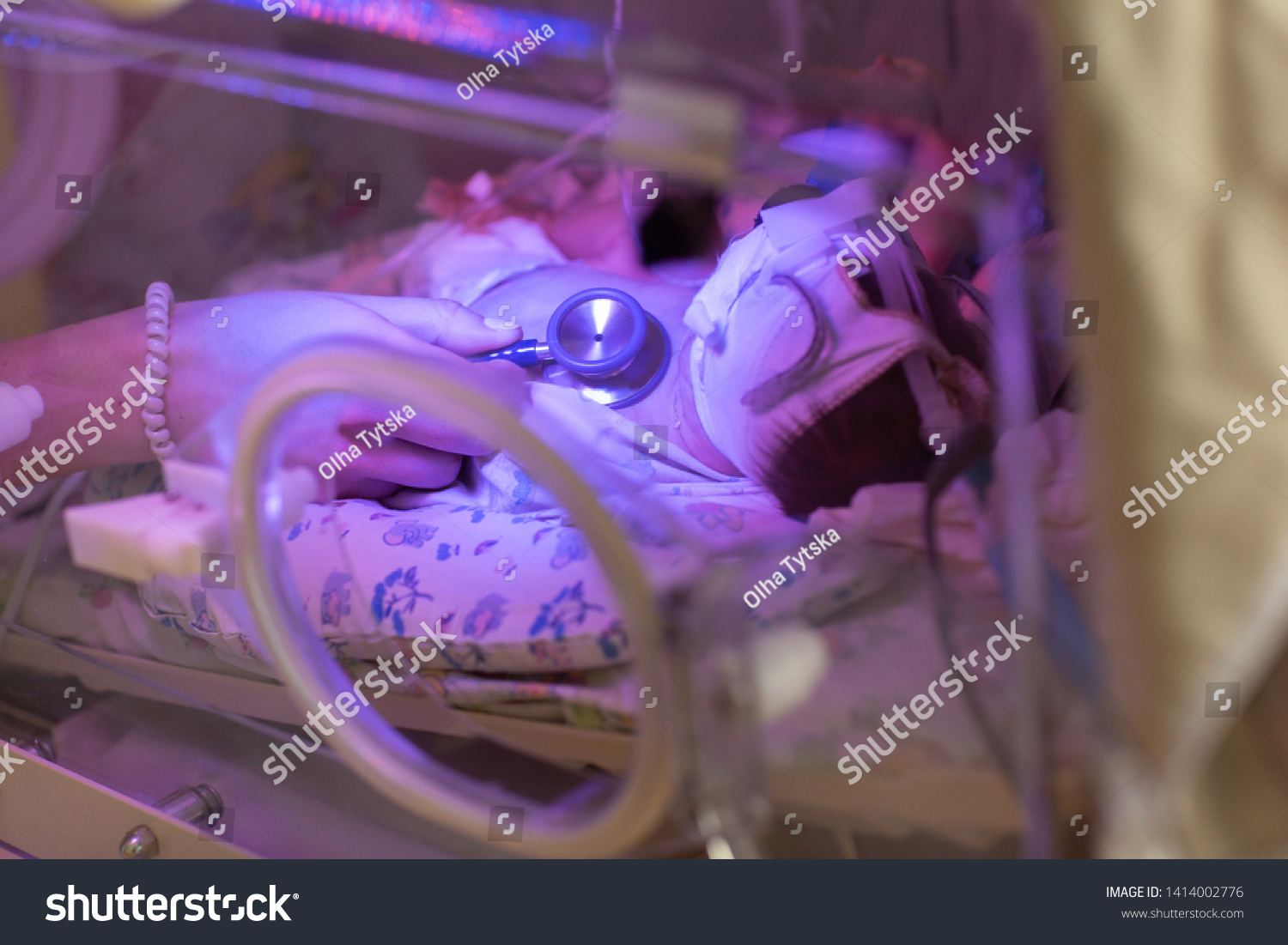 Female Doctor Examining Newborn Baby Incubator Stock Photo