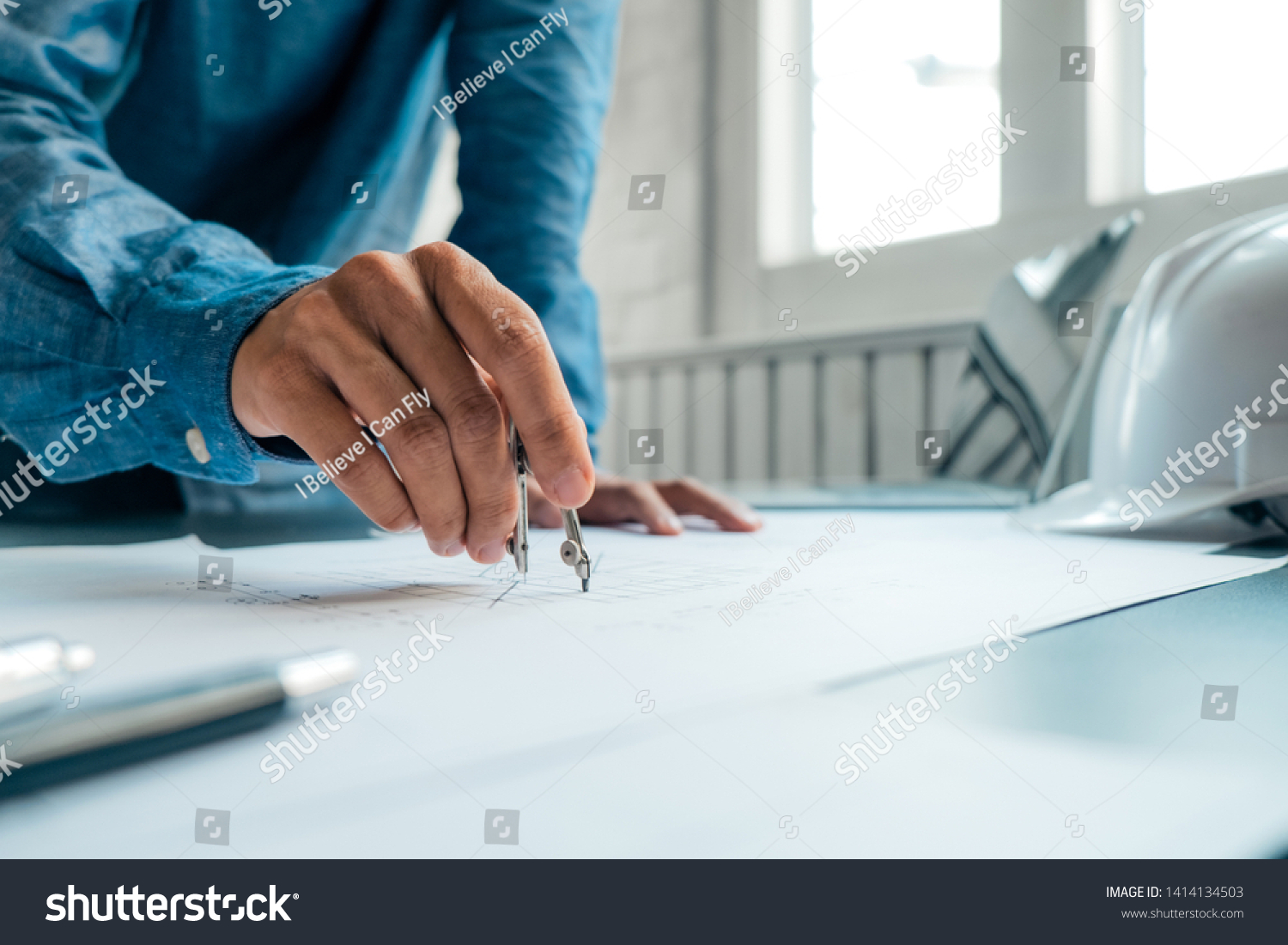 Engineers Pointing Building On Blueprint Using Stock Photo