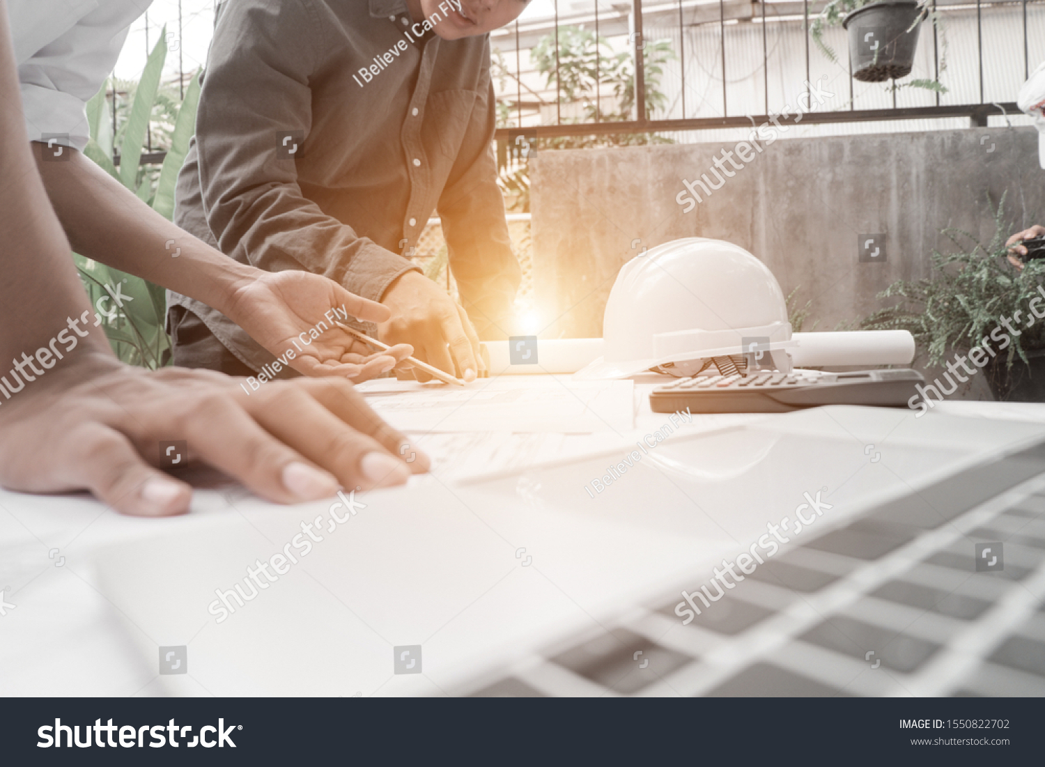 Engineers Pointing Building On Blueprint Drawing Stock Photo 1550822702