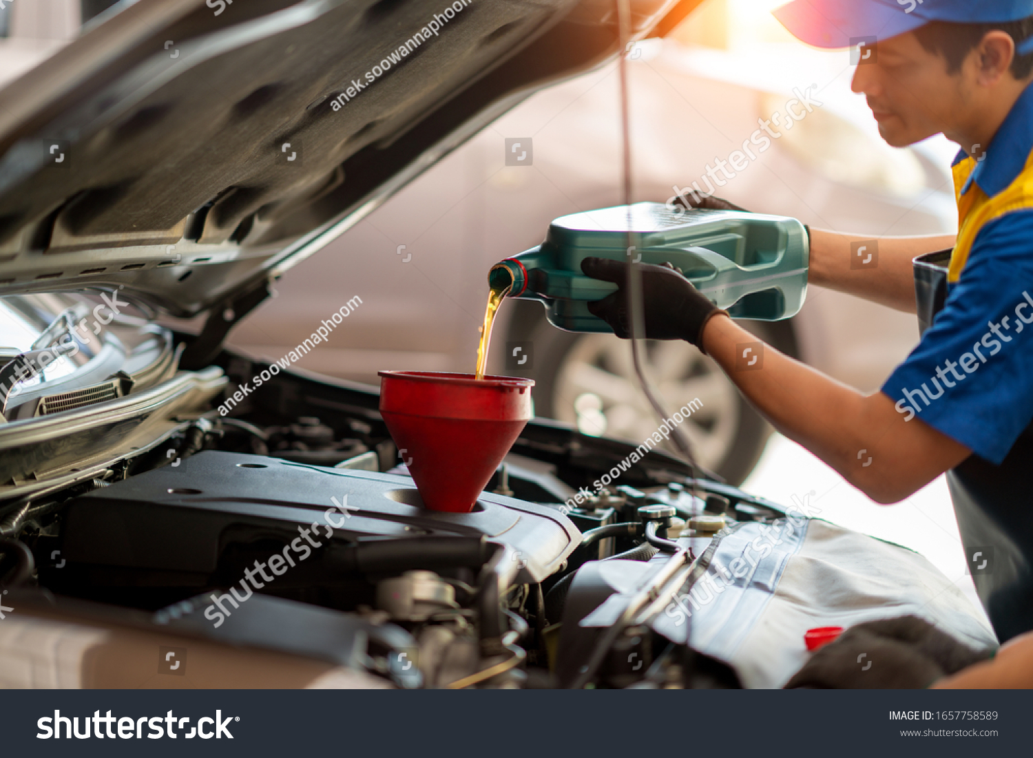 Pouring Oil Car Engine Mechanic Pouring Stock Photo 1657758589