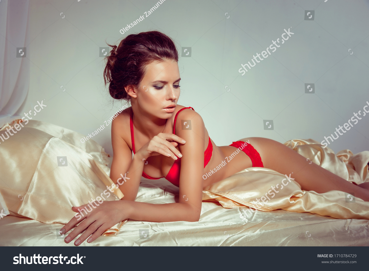 Attractive Woman Sexy Red Lingerie Lying Stock Photo