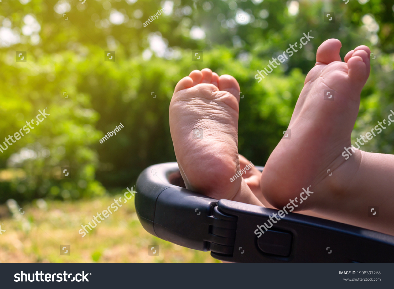 Naked Caucasian Baby Feet Stroller Closeup Stock Photo